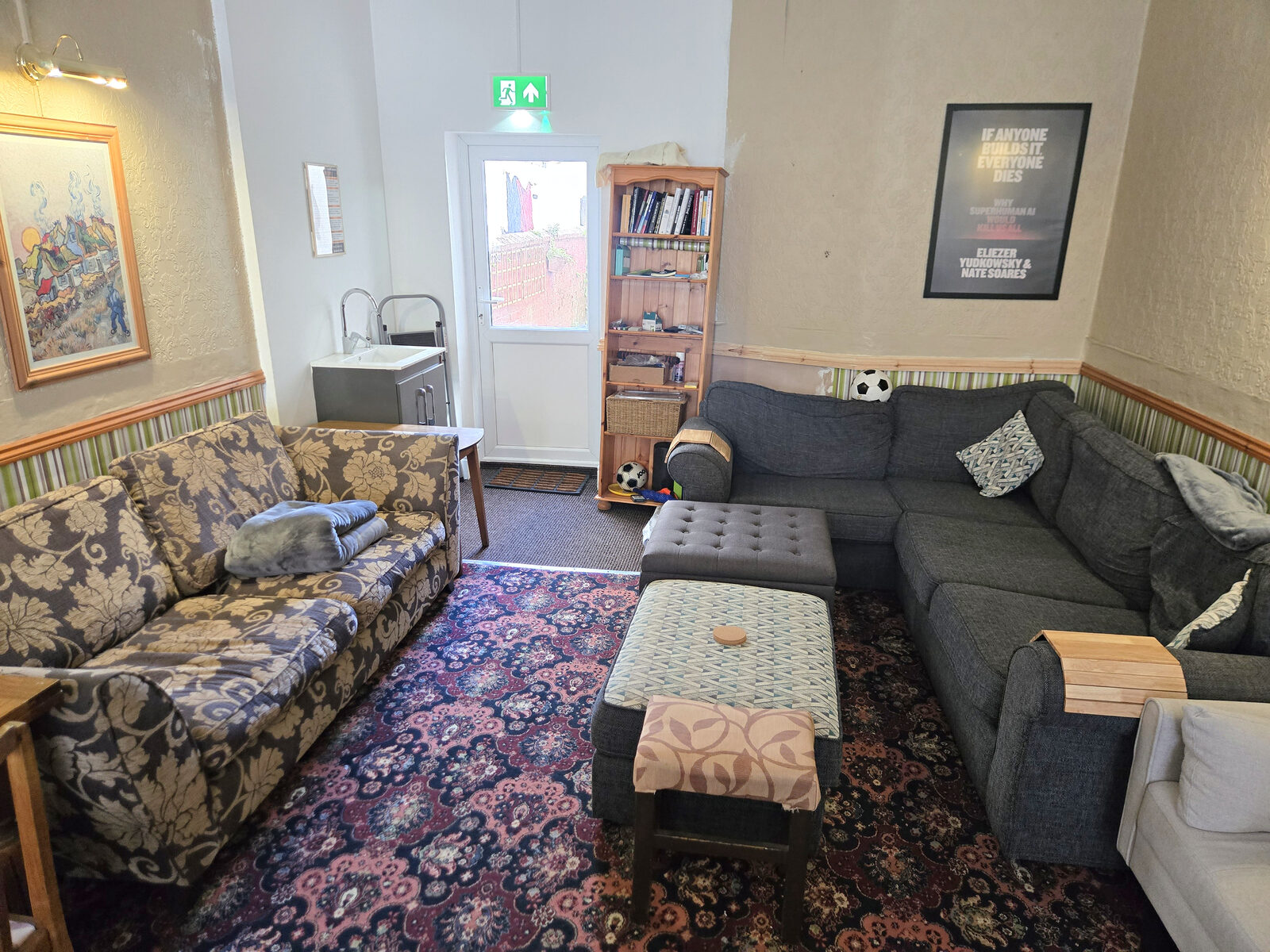 Sofas and bookshelves in the lounge at Moratorium House
